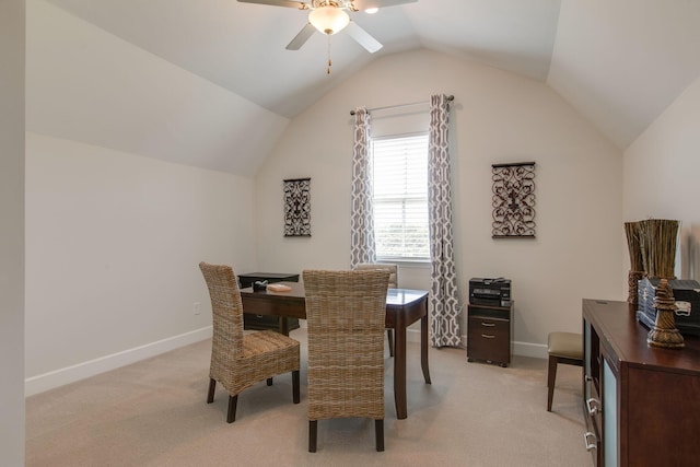 dining area with light colored carpet, lofted ceiling, a ceiling fan, and baseboards