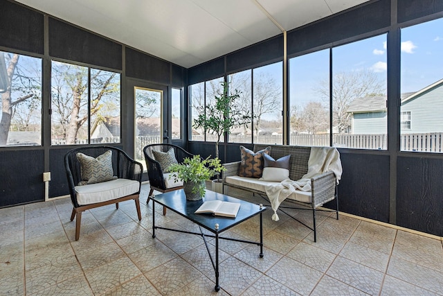 sunroom featuring outdoor lounge area