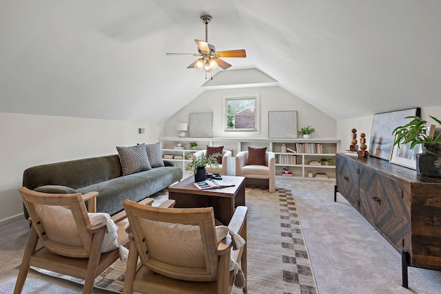 living area featuring light colored carpet, ceiling fan, and vaulted ceiling