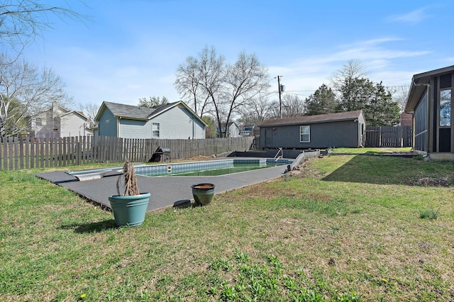 view of yard with a residential view, a fenced in pool, and a fenced backyard