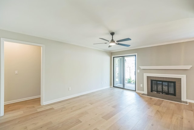 unfurnished living room with crown molding, light wood-type flooring, a ceiling fan, and baseboards
