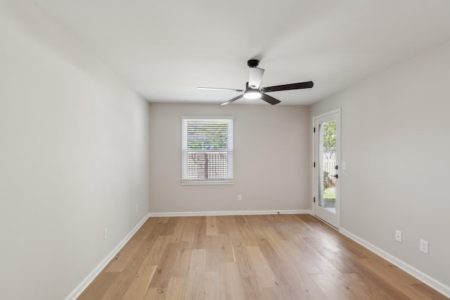 empty room with light wood-type flooring, baseboards, and ceiling fan