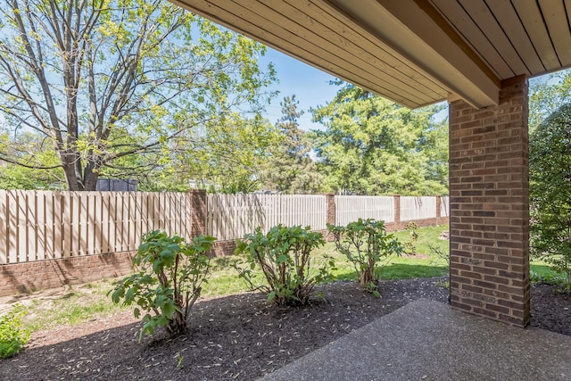view of patio featuring fence
