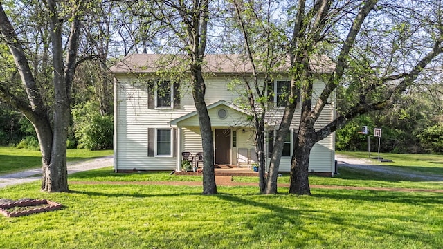 524 Woods Dr, Columbia, TN 38401 - colonial inspired home with a front lawn and dirt driveway