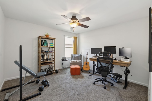 home office with a ceiling fan, carpet flooring, and baseboards