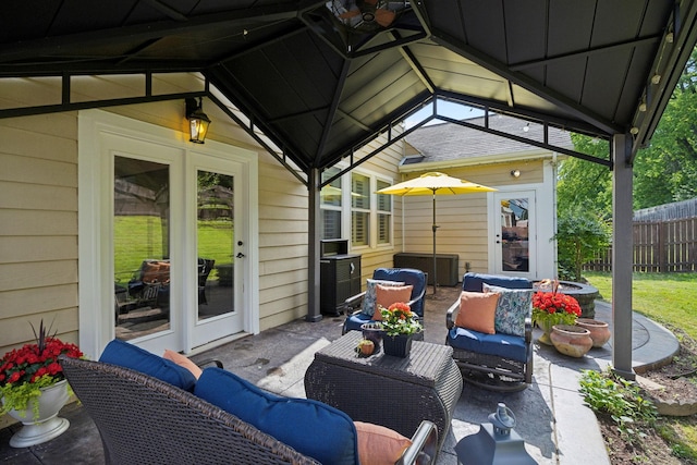 view of patio / terrace with fence, outdoor lounge area, and french doors