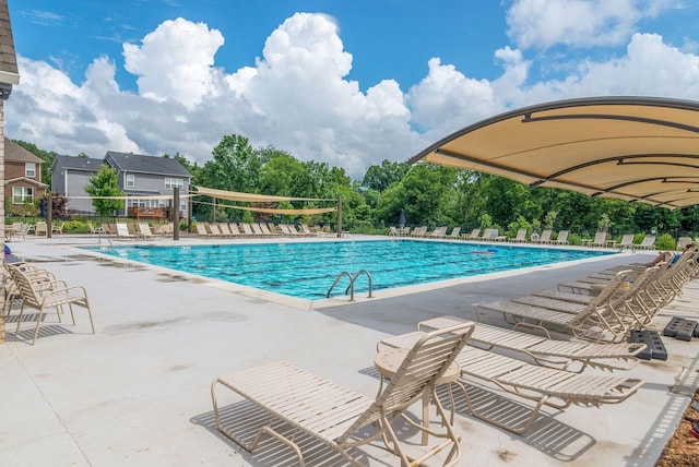 110 Curry Ct, Franklin, TN 37064 - community pool with fence, a patio area, and view of wooded area