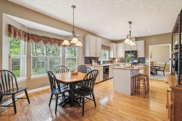 313 Walpole Ct, Nolensville, TN 37135 - dining area with recessed lighting, light wood-style floors, a textured ceiling, and baseboards