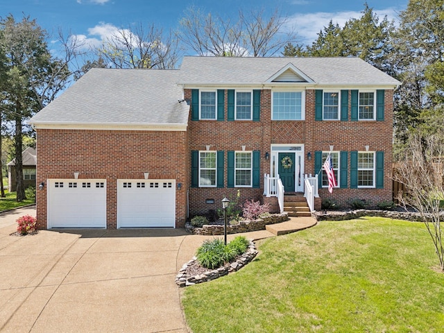 313 Walpole Ct, Nolensville, TN 37135 - colonial-style house with an attached garage, a front lawn, driveway, and brick siding
