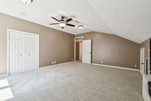 313 Walpole Ct, Nolensville, TN 37135 - unfurnished bedroom with light colored carpet, vaulted ceiling, a textured ceiling, and baseboards