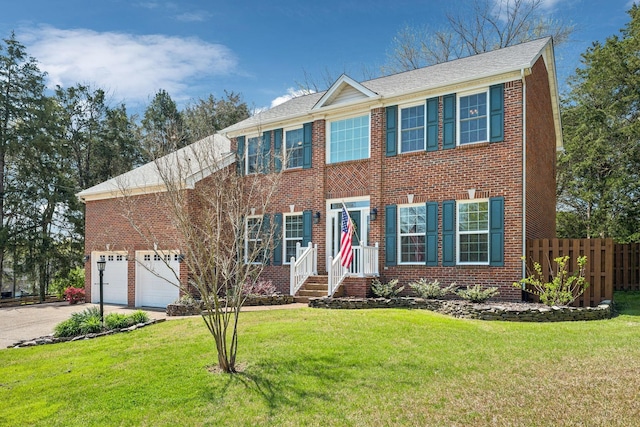 313 Walpole Ct, Nolensville, TN 37135 - colonial-style house with brick siding, a front lawn, concrete driveway, and fence