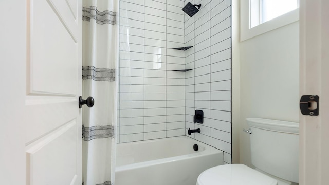 full bath featuring shower / bath combo and toilet