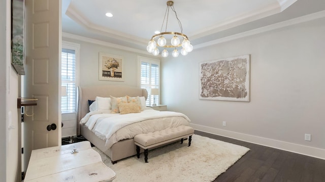 bedroom featuring recessed lighting, dark wood-style floors, an inviting chandelier, a raised ceiling, and baseboards