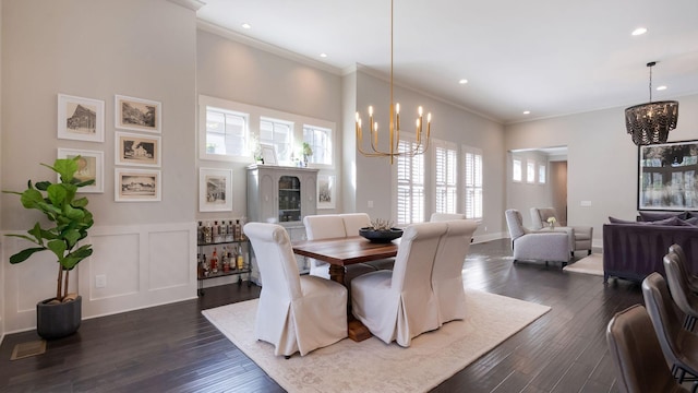 dining room featuring dark wood finished floors, crown molding, a chandelier, and recessed lighting