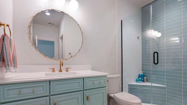 full bathroom with a shower stall, visible vents, toilet, and vanity