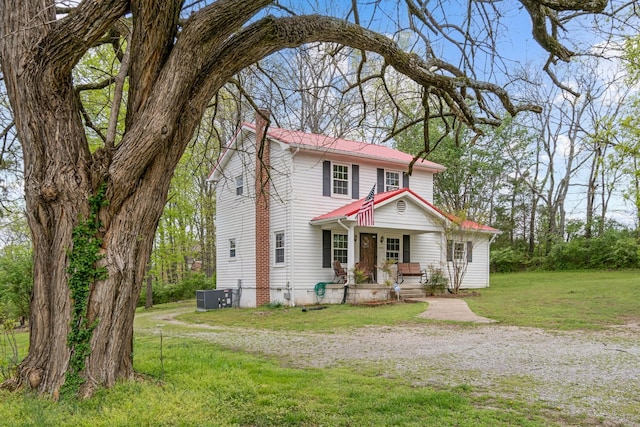 4103 Arno Rd, Franklin, TN 37064 - traditional-style house featuring a porch, a front lawn, a chimney, and central air condition unit