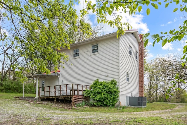 4103 Arno Rd, Franklin, TN 37064 - rear view of house featuring a lawn, central AC, and a deck
