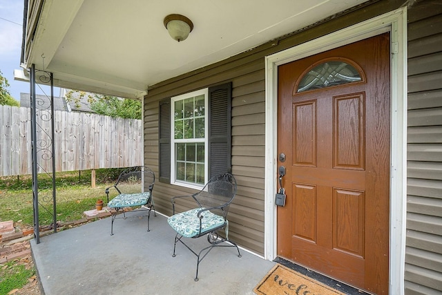 212 Mullican St, Mcminnville, TN 37110 - view of exterior entry with a porch and fence