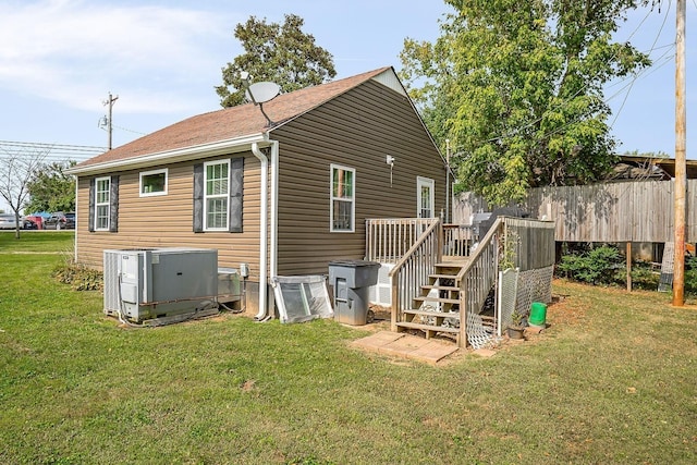 212 Mullican St, Mcminnville, TN 37110 - back of house with fence, a deck, a yard, and central AC unit