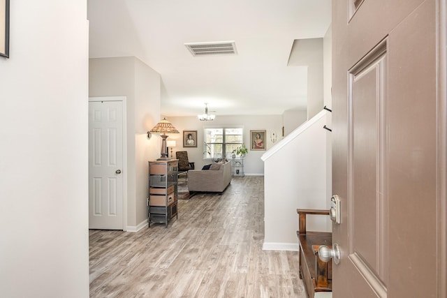 1517 Rockwood Ln, Lebanon, TN 37087 - hall with stairway, light wood-type flooring, an inviting chandelier, baseboards, and visible vents