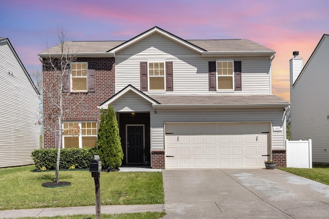 1517 Rockwood Ln, Lebanon, TN 37087 - view of front of home with concrete driveway, brick siding, an attached garage, a shingled roof, and a lawn