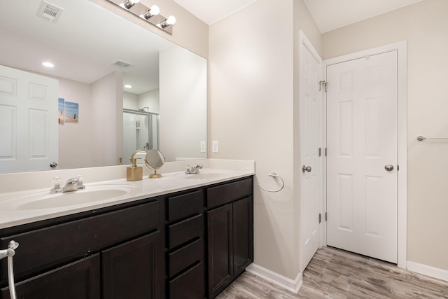 1517 Rockwood Ln, Lebanon, TN 37087 - full bathroom with wood finished floors, visible vents, a sink, and double vanity