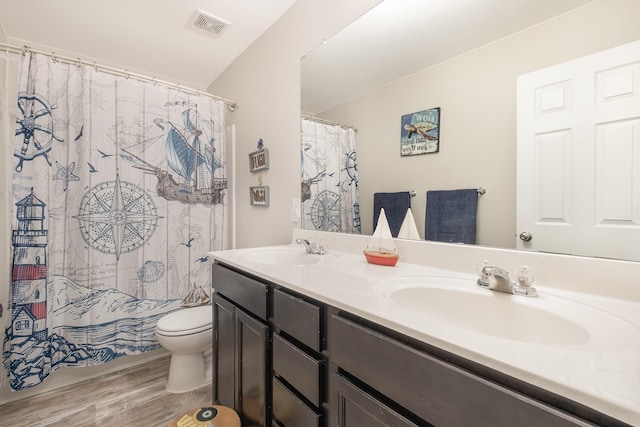 1517 Rockwood Ln, Lebanon, TN 37087 - bathroom with wood finished floors, visible vents, toilet, and a sink
