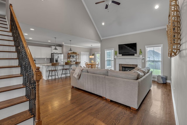 1026 Claymill Dr, Spring Hill, TN 37174 - living room with high vaulted ceiling, stairway, a ceiling fan, ornamental molding, and dark wood-style floors