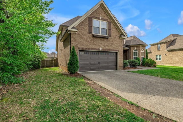 1026 Claymill Dr, Spring Hill, TN 37174 - traditional-style home featuring driveway, an attached garage, fence, a front yard, and brick siding