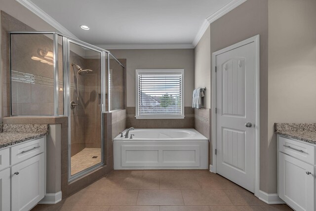 1026 Claymill Dr, Spring Hill, TN 37174 - full bathroom featuring a garden tub, tile patterned flooring, vanity, and a stall shower