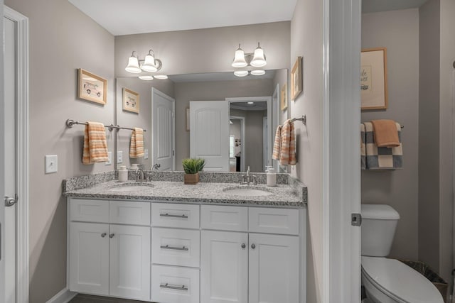 1026 Claymill Dr, Spring Hill, TN 37174 - full bathroom with baseboards, a sink, double vanity, and toilet