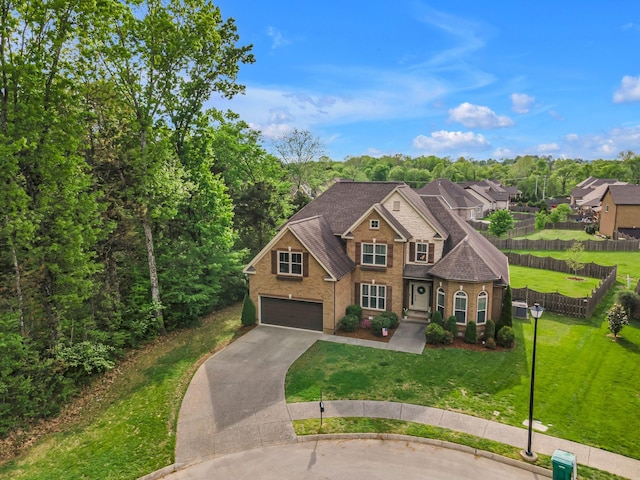1026 Claymill Dr, Spring Hill, TN 37174 - traditional home featuring roof with shingles, a front lawn, driveway, fence, and an attached garage