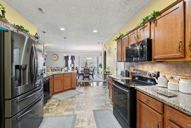 3367 William Bailey Dr, Nashville, TN 37207 - kitchen featuring a peninsula, tasteful backsplash, brown cabinets, light stone counters, and black appliances