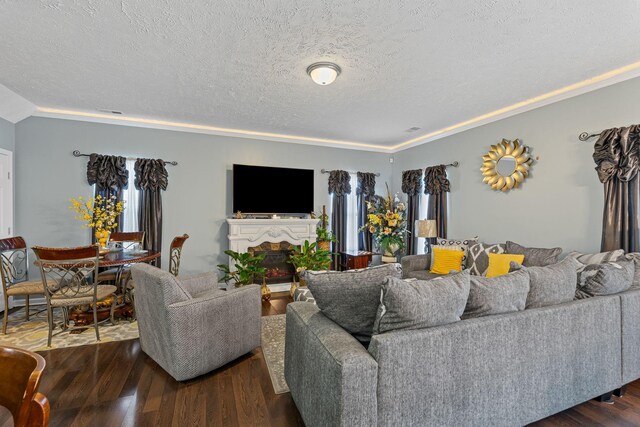 3367 William Bailey Dr, Nashville, TN 37207 - living area with a fireplace, dark wood-style floors, a textured ceiling, and ornamental molding
