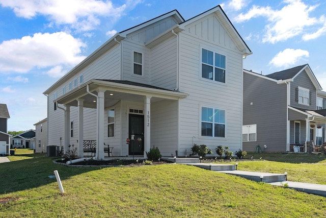 view of front facade with cooling unit, a front yard, board and batten siding, and covered porch
