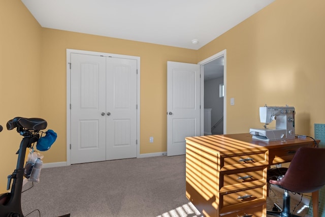carpeted office space with baseboards