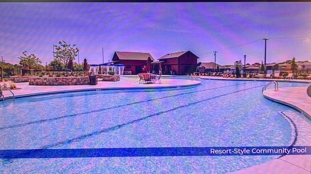 pool with a patio area