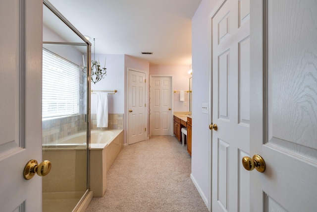 304 Hay Market Ct, Franklin, TN 37067 - bathroom featuring a bath, visible vents, vanity, and a shower with door