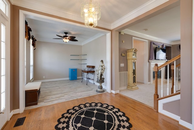 304 Hay Market Ct, Franklin, TN 37067 - entryway with baseboards, visible vents, wood finished floors, stairs, and crown molding