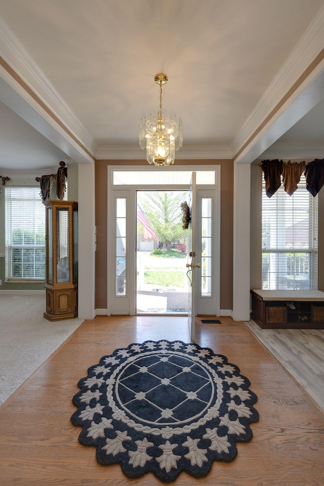 304 Hay Market Ct, Franklin, TN 37067 - entryway featuring baseboards, crown molding, wood finished floors, and a chandelier