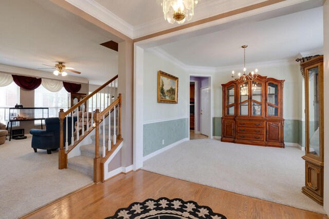 304 Hay Market Ct, Franklin, TN 37067 - carpeted foyer entrance with baseboards, ceiling fan with notable chandelier, wood finished floors, stairway, and ornamental molding