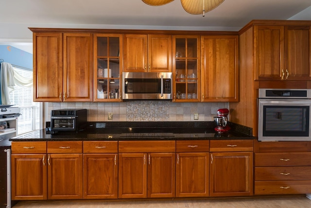 304 Hay Market Ct, Franklin, TN 37067 - kitchen featuring brown cabinetry and appliances with stainless steel finishes