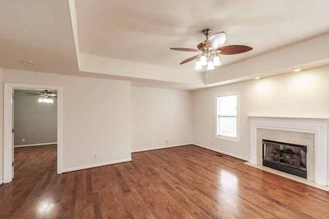 327 Arabian Ln, Springfield, TN 37172 - unfurnished living room with baseboards, a ceiling fan, wood finished floors, and a fireplace