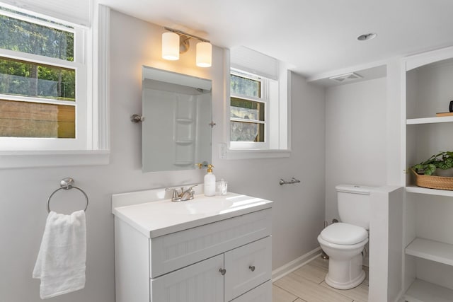 full bathroom featuring visible vents, baseboards, vanity, and toilet