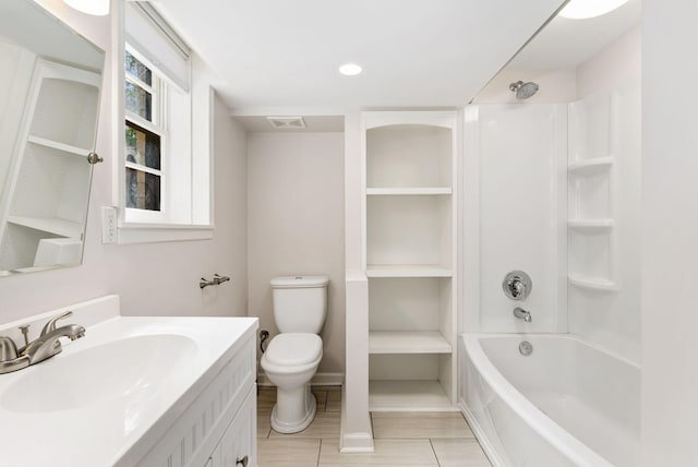 full bathroom featuring toilet, visible vents, tile patterned flooring, washtub / shower combination, and vanity