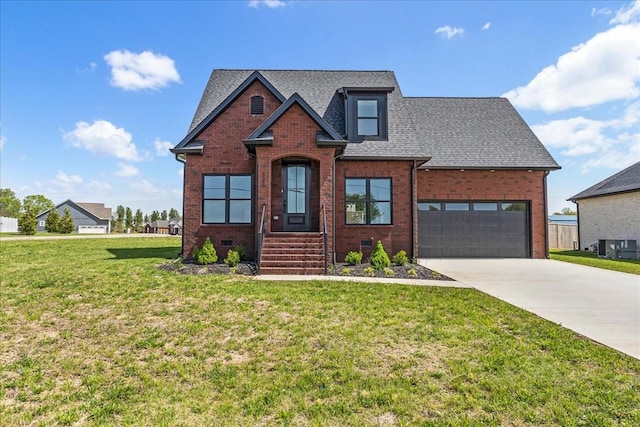 traditional home featuring driveway, brick siding, a garage, a shingled roof, and a front yard