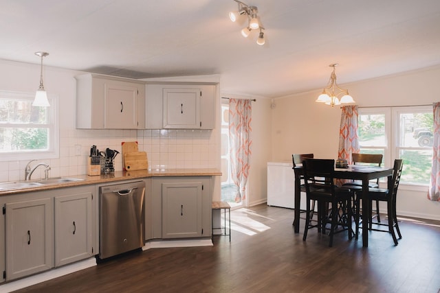 1005 Chris Dr, Portland, TN 37148 - kitchen with an inviting chandelier, dishwasher, a sink, dark wood-type flooring, and tasteful backsplash