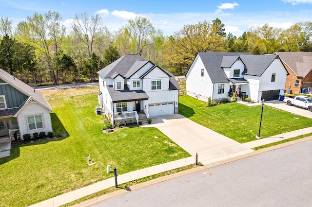 view of front of property with driveway, a shingled roof, an attached garage, a porch, and a front yard