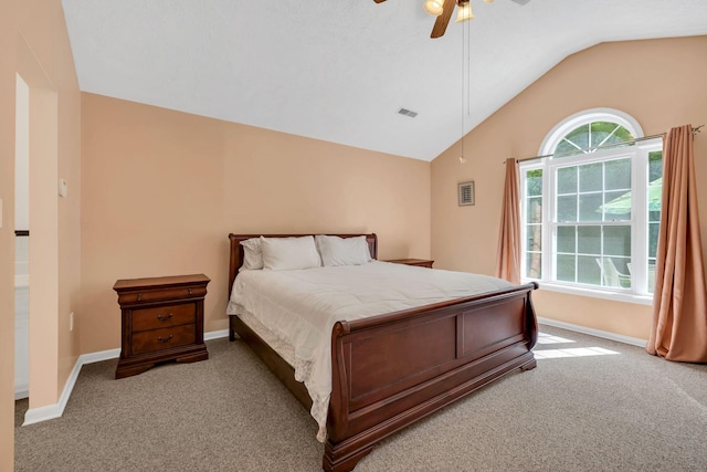 carpeted bedroom featuring lofted ceiling, baseboards, ceiling fan, and visible vents