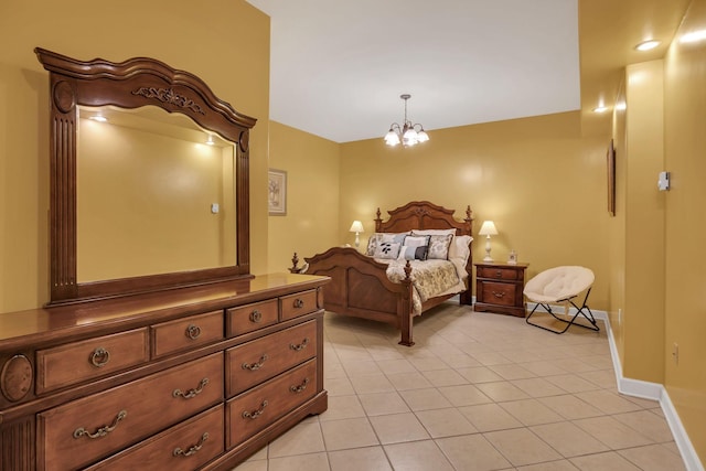 bedroom with baseboards, a notable chandelier, and light tile patterned floors